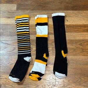 REEBOK black and gold knee high socks.